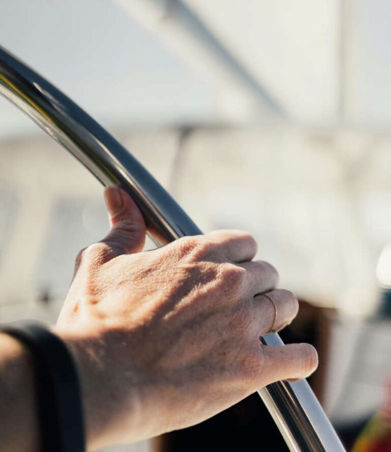 Navigator's hand on wheel bearing for the North Star